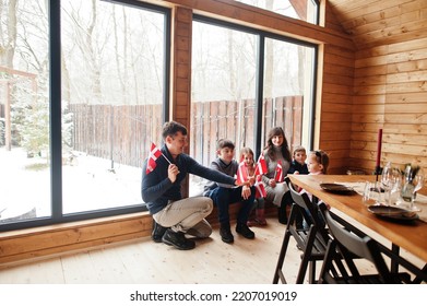 Family With Denmark Flags Inside Wooden House. Travel To Scandinavian Countries. Happiest Danish People's .