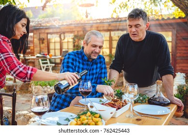 Family Dining Outdoor At Backyard Patio