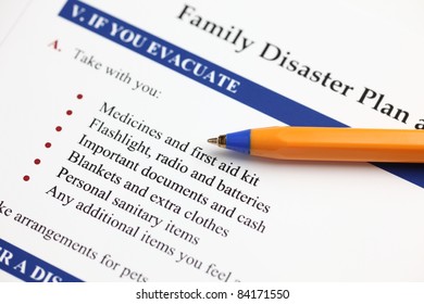 Family Disaster Plan And Ballpoint Pen. Close-up.