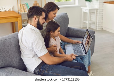 Family Doctor Online. Happy Family Consults Using Video Conference Computer At Home.