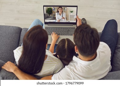 Family Doctor Online. Parents With Daughter Talking To Doctor Online On Laptop From Home