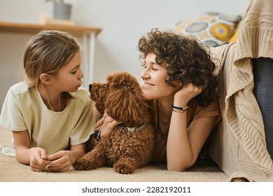 Family with dog enjoying time together - Powered by Shutterstock