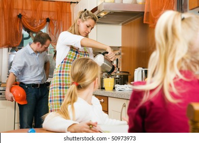 Family Doing Their Breakfast Routine In The Morning, Dad Is Ready To Start To Work