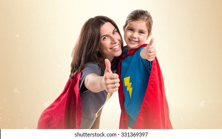 Family Dressed Like Superhero With Thumb Up