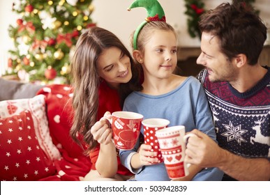 Family Drinking Hot Chocolate At Christmas 