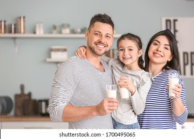 Family Drinking Milk At Home