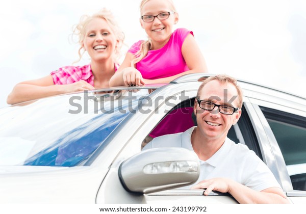 Family driving in car\
