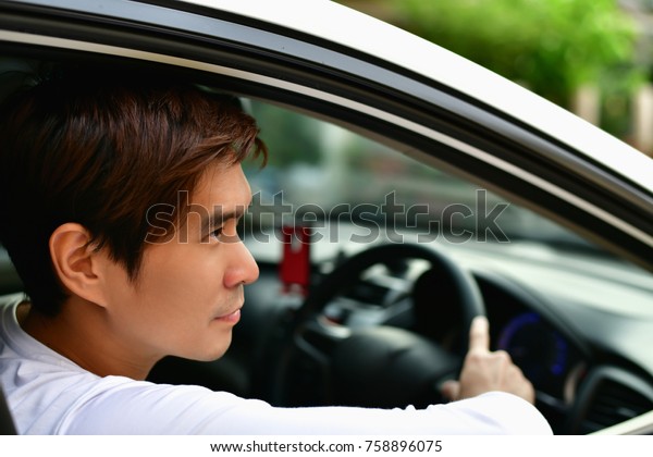 family Driving, male\
driving, safe driving concept, driver\'s view, family are driving\
safely on a safe route.