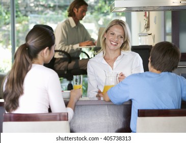 A family eating breakfast - Shutterstock ID 405738313