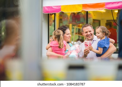 Family Eating At Fair