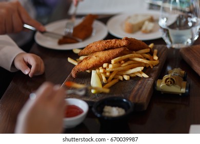 Family Eating Fish And Chips