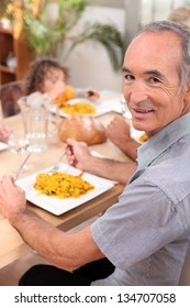 Family Eating Paella