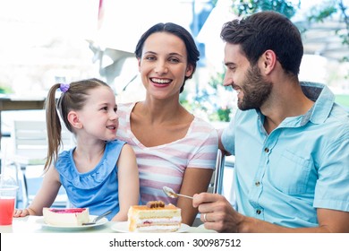 A Family Eating At The Restaurant On A Sunny Day