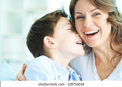 Family Of Ecstatic Mother And Son Laughing