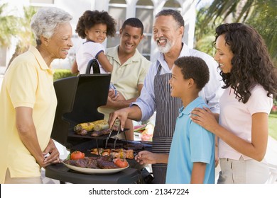 Family Enjoying A Barbeque