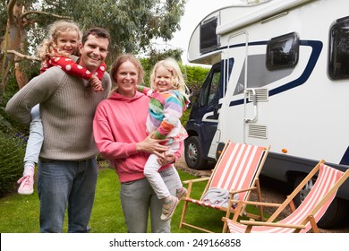 Family Enjoying Camping Holiday In Camper Van 