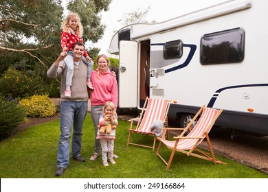 Family Enjoying Camping Holiday In Camper Van 