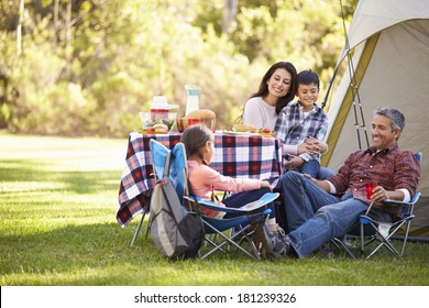 Family Enjoying Camping Holiday In Countryside - Shutterstock ID 181239326