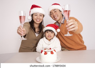 Family Enjoying The Christmas Party