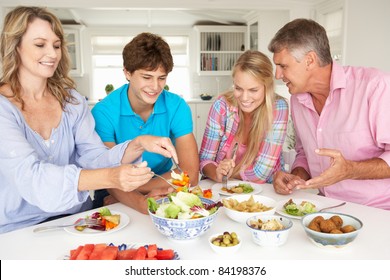 Family Enjoying Meal At Home