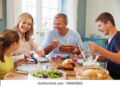 Family Enjoying Meal At Home Together - Powered by Shutterstock