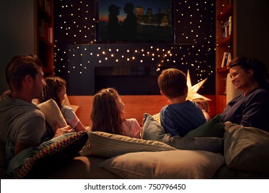 Family Enjoying Movie Night At Home Together - Shutterstock ID 750796450