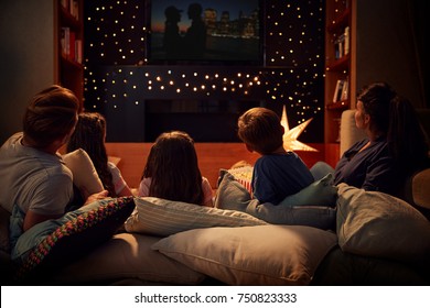 Family Enjoying Movie Night At Home Together - Shutterstock ID 750823333