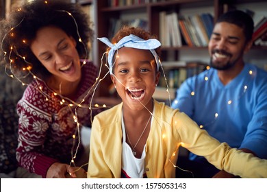 Family Enjoying On Winter Holiday.happy African American Family Celebrate Christmas Together