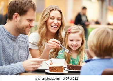 Family Enjoying Snack In Cafe Together - Powered by Shutterstock