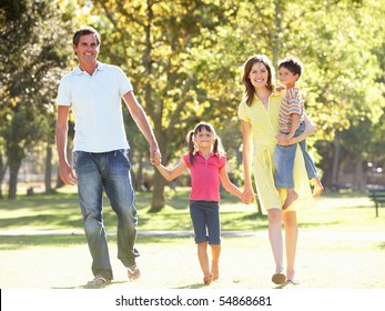 Family Enjoying Walk In Park - Powered by Shutterstock