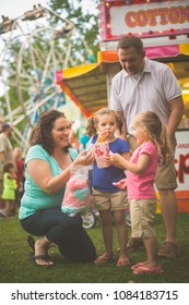 Family At Fair Eating Food