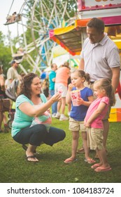 Family At Fair Eating Food