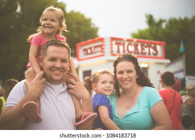 Family At Fair Ready For Fun