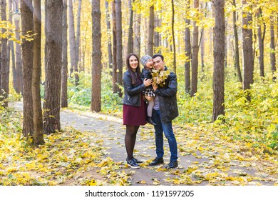 Family, fall, people concept - mixed race young family walking in park on in autumn day - Shutterstock ID 1191597205