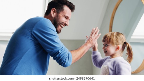 Family, father and child with high five in home for bonding, support and excited for achievement. Parent, girl kid and celebration in house with motivation, happy and congratulations with development - Powered by Shutterstock