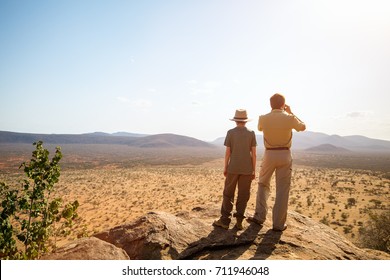 Family Of Father And Child On African Safari Vacation Enjoying View Over Samburu Kenya