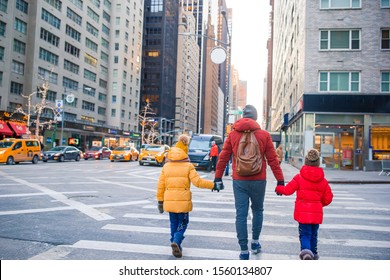 Family Of Father And His Little Kids Walk On Manhattan In New York City