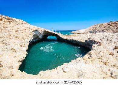 Family Of Father And Kids Enjoying Idyllic Kapros Beach On Greek Island Of Milos