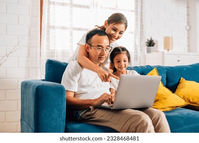 Family father mother and daughter using laptop and surfing internet - Powered by Shutterstock