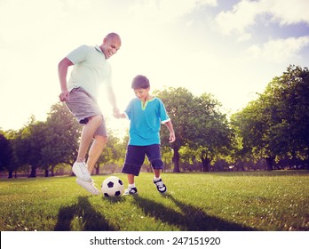 Family Father Son Playing Football Summer Concept