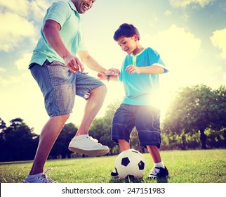 Family Father Son Playing Football Summer Concept - Powered by Shutterstock