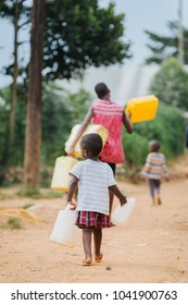 family fetching water in Uganda Africa