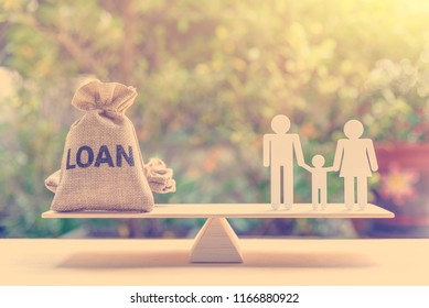 Family Finance / Financial Loan And Risk Management Concept : Loan Bags, White Acrylic Cut (dad, Mom, Son) On Basic Balance Scale, Depicts Loan Between Family Members, Not Use A Bank Or Credit Union.