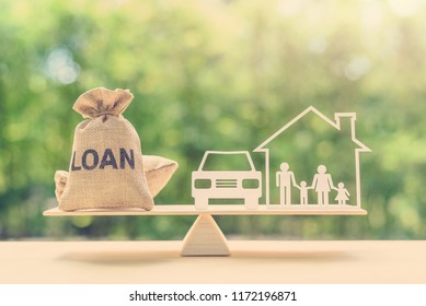 Family financial management, mortgage and payday loan or cash advance concept : Loan bags, family in a house on balance scale, depicts short term borrowing, high interest rate based on credit profile - Shutterstock ID 1172196871