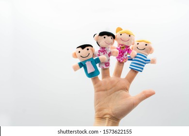 family finger puppet theater. hand with finger puppets: son, daughter,mum, dad. playing show fingers puppets. Family concept.