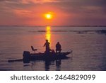 Family fishes for bass from a boat at sunset on Lake Okeechobee, Florida . Created 05.09.24 