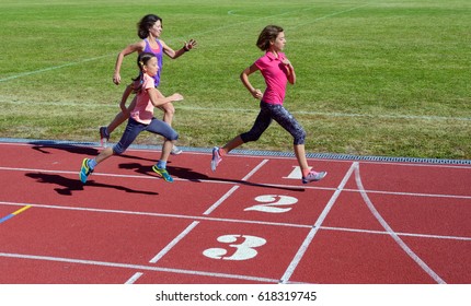 Family Fitness, Mother And Kids Running On Stadium Track, Training And Children Sport Healthy Lifestyle Concept
