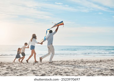 Family, flying kite and holding hands on beach together for holiday, travel or vacation in summer. Energy, love or running with mother, father and kids on sand at coast by ocean or sea for bonding - Powered by Shutterstock