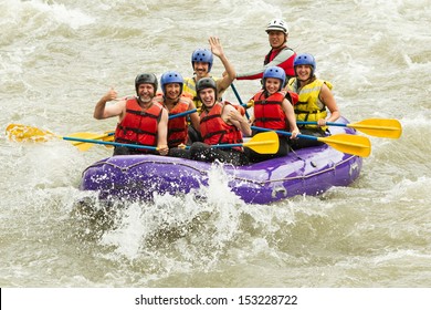 A family of four navigating a white water rafting adventure on a rushing river, their boat bouncing through the extreme rapids. - Powered by Shutterstock