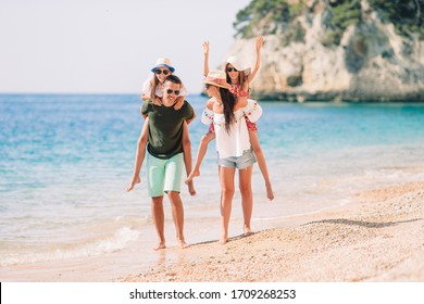 Family of four on beach vacation